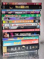 Side view of stacked DVD cases showing titles