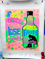 Full view of fluorescent poster with slogan and bottle graphic