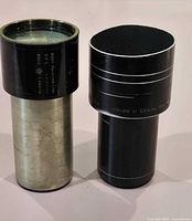 Front view of both projection lenses standing upright