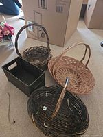 All four wicker baskets displayed on floor