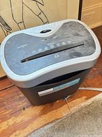 Front angled view showing full unit, dust, power cord