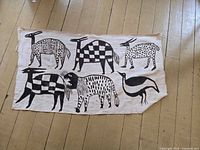 Full view of fabric panel showing all six animal motifs