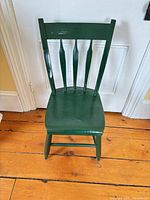 Full view of green painted spindle-back wooden chair