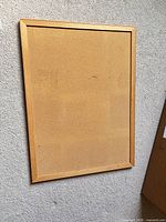 Front view of cork pin board showing full surface and frame
