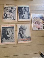 Top and bottom view of five art books laid out