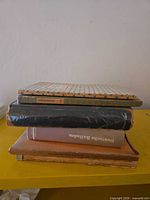 Stack of five vintage German books showing covers and spines