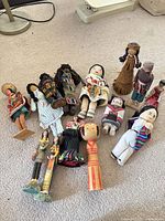 Group view of all dolls laying on carpet