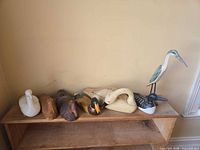 All seven bird figures on shelf