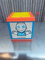 Front panel showing clown graphic and overall box