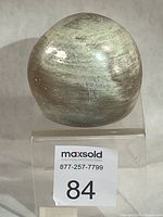 Front view of rounded stoneware salt shaker showing glaze tones and MaxSold lot label 84