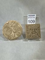 Both paperweights together for scale and design overview