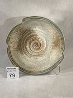 Top view of stoneware bowl showing glaze pattern and altered rim