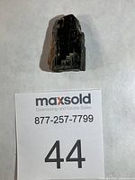 Overall view of the black tourmaline crystal standing upright