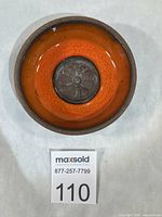 top view showing orange interior and flower medallion