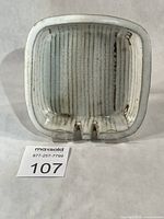 Front view showing overall form, glaze, and cigarette rests