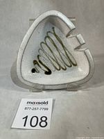 Front view of triangular ashtray showing overall shape and glaze