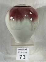 Front view of Cheri Sydor stoneware vase showing red to celadon glaze