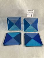 All four fused glass coasters displayed front view