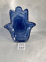 Front view of indigo alabaster glass Hamsa hand bowl