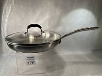 Side view of skillet with lid showing overall form and handle