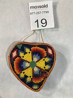 Front view showing full peyote flower bead pattern and shape