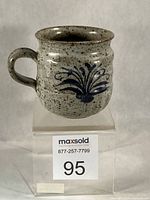 Front view of stoneware mug showing cobalt motif and overall glaze