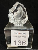 Front view of crystal paperweight showing full bald eagle engraving