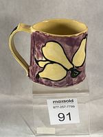 Left profile of mug showing large pear design and overall glaze