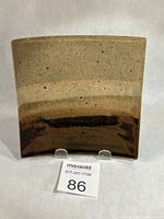 Front view of square shallow dish showing glaze pattern