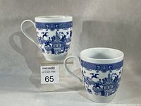 Two Calamityware mugs side by side showing pattern and shape