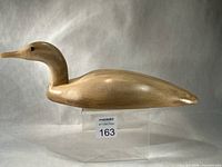 Full side profile of wooden loon showing overall form