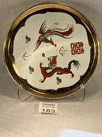 Front view showing dragon, phoenix, double happiness symbol and gilt rim