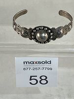 Full view of Navajo sterling concho cuff bracelet