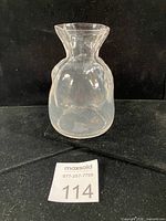 Front view of clear sack-form glass vase