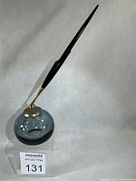 Entire desk holder with demonstration pen attached