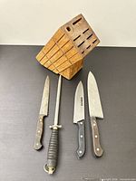 knife block and four cutlery tools laid out