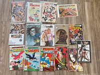 Group shot of 15 assorted comic books laid out in four rows