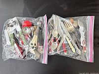 Both bags closed showing full assortment of kitchenware