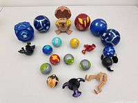 full group of Bakugan balls and figures laid out on table