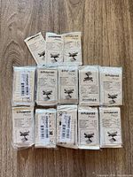 All twelve sealed Polaroid PoGo ZINK photo paper packs displayed