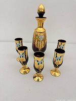 full set showing decanter with stopper and five glasses