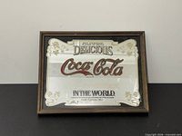 Front view of framed Coca-Cola mirror showing full design