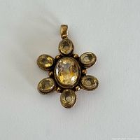 Front view showing star-flower design and gemstones