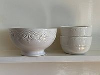 Group shot of footed bowl and two stacked coupe bowls