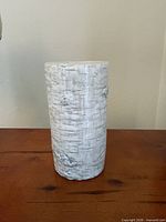 Full view of candle showing faux birch bark exterior