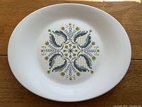 Full view of oval plate showing entire Suburbia pattern