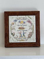 Front view showing full tile design and wood frame