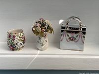 Three miniature porcelain items side by side