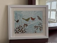 Framed print on furniture showing overall view