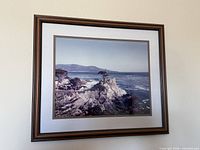 Full view of framed photograph on wall